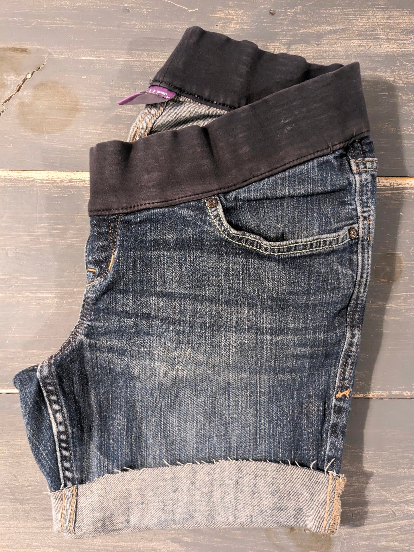 Hand-embroidered under-belly panel 4.5" cuffed hem denim shorts, Medium wash